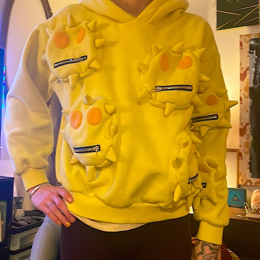 SYCKLI is a Japanese brand that creates these gems. Six zipper pockets and hood.